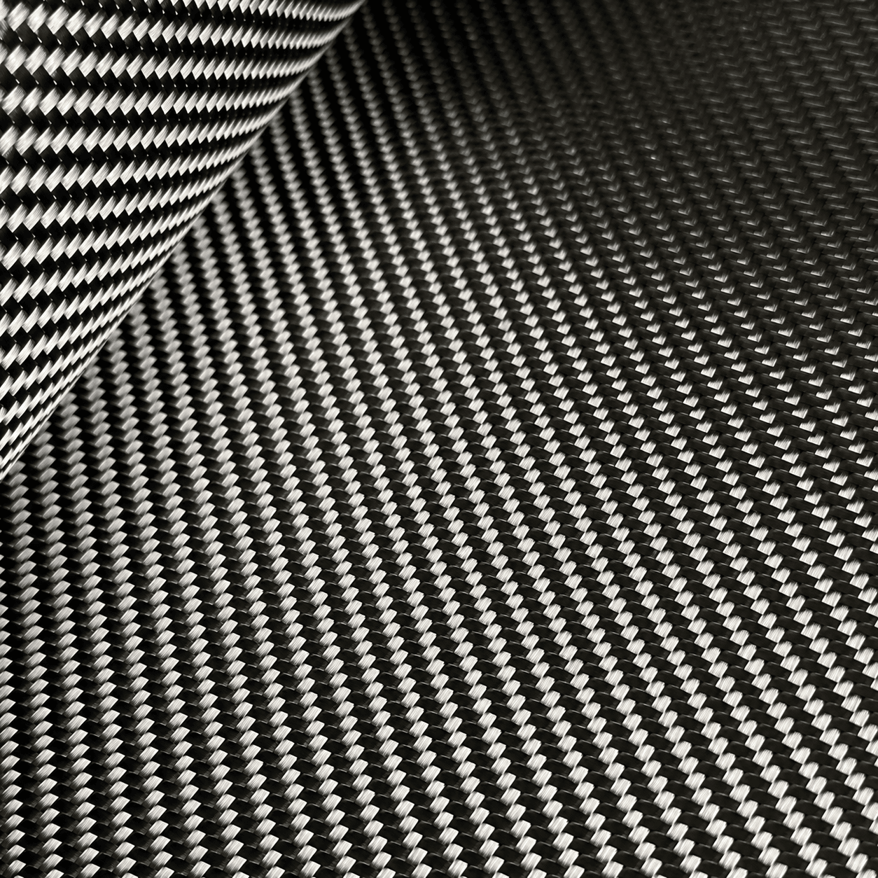 Glossy 3K twill carbon fiber fabric close-up for composite manufacturing