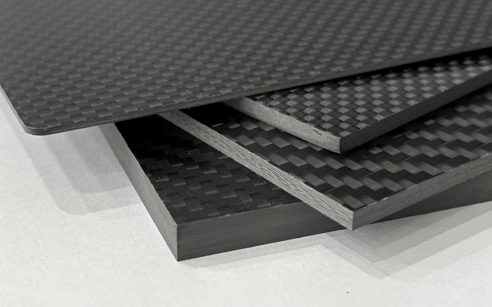 Carbon fiber laminate stack for automotive and drone composite parts