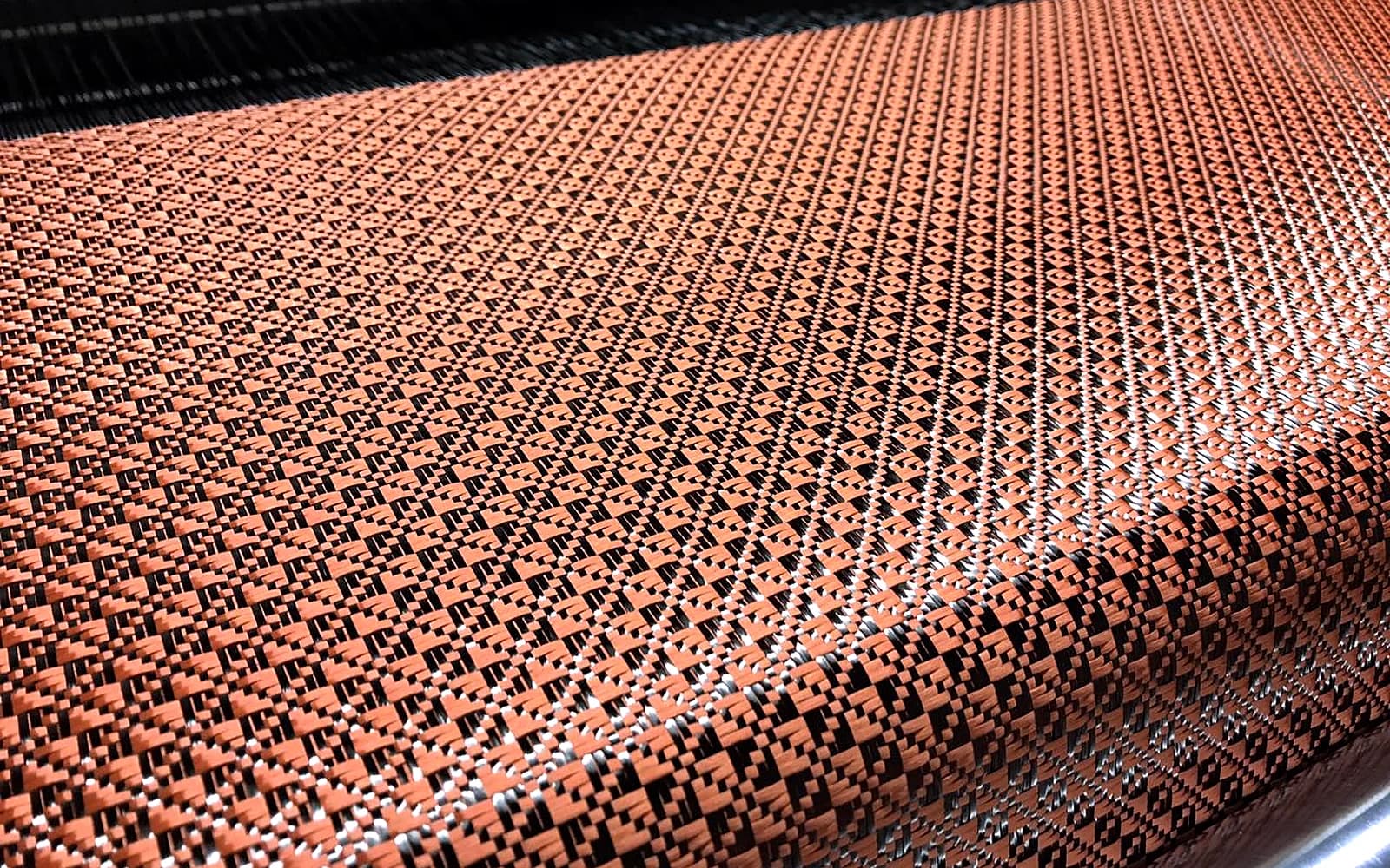 orange carbon aramid hybrid jacquard fabric roll